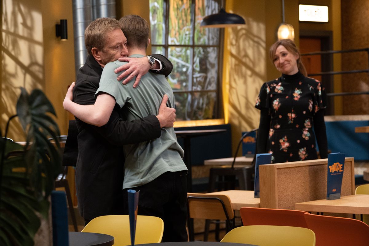 Laurel Thomas smiles as Marshall hugs his dad at HOP