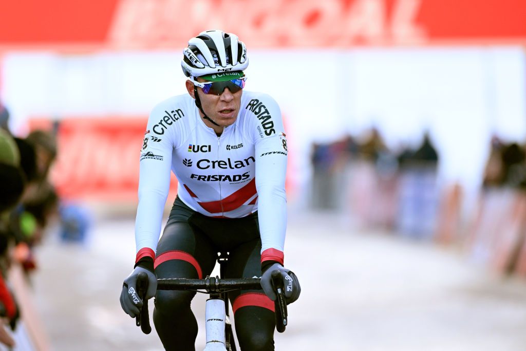 VERMIGLIO ITALY DECEMBER 17 Laurens Sweeck of Belgium and Team CrelanFristads crosses the finish line in fourth position during the 2nd UCI Cyclocross World Cup Val Di Sole 2022 Mens Elite CXWorldCup on December 17 2022 in Vermiglio Italy Photo by Dario BelingheriGetty Images