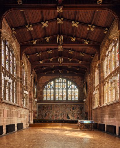 Fig 2: The great hall. Behind the dais is a tapestry commissioned by the guild in 1505&ndash;15. Credit: Paul Highnam