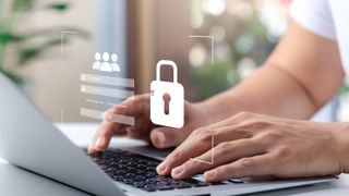 Hands on a computer keyboard with a lock icon 