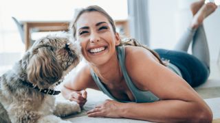 pretty lady exercising with dog