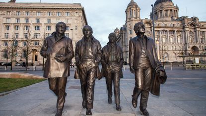 A statue of The Beatles by sculptor Andy Edwards in Liverpool, England 