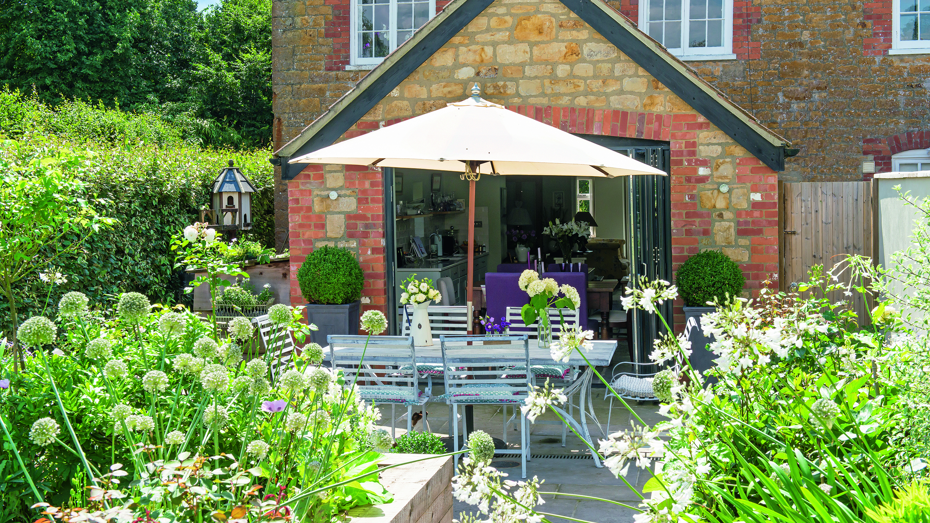 Garden with parasol over garden table