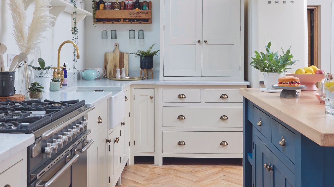 White kitchen with navy island