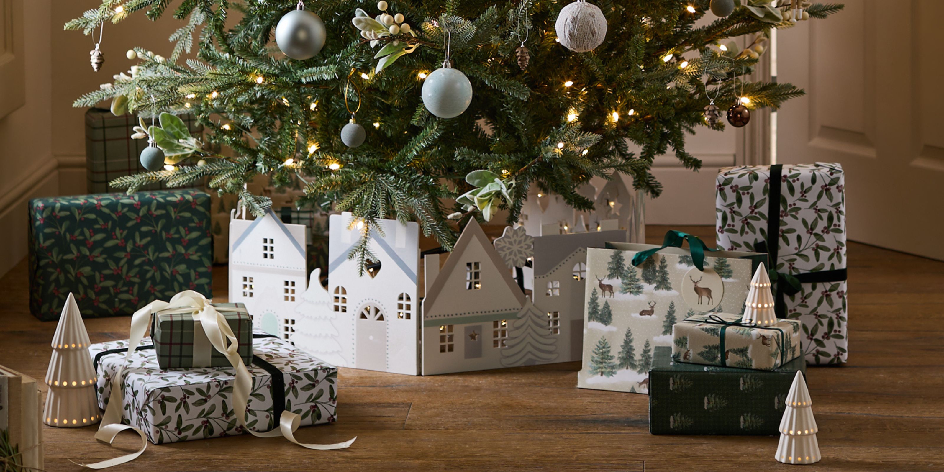A white wooden village Christmas tree skirt from Next