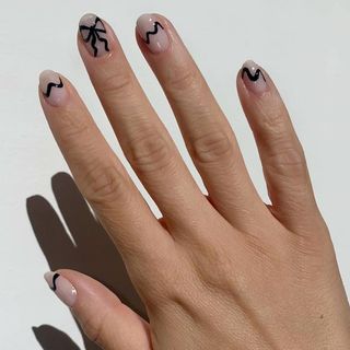 Black bow nail design