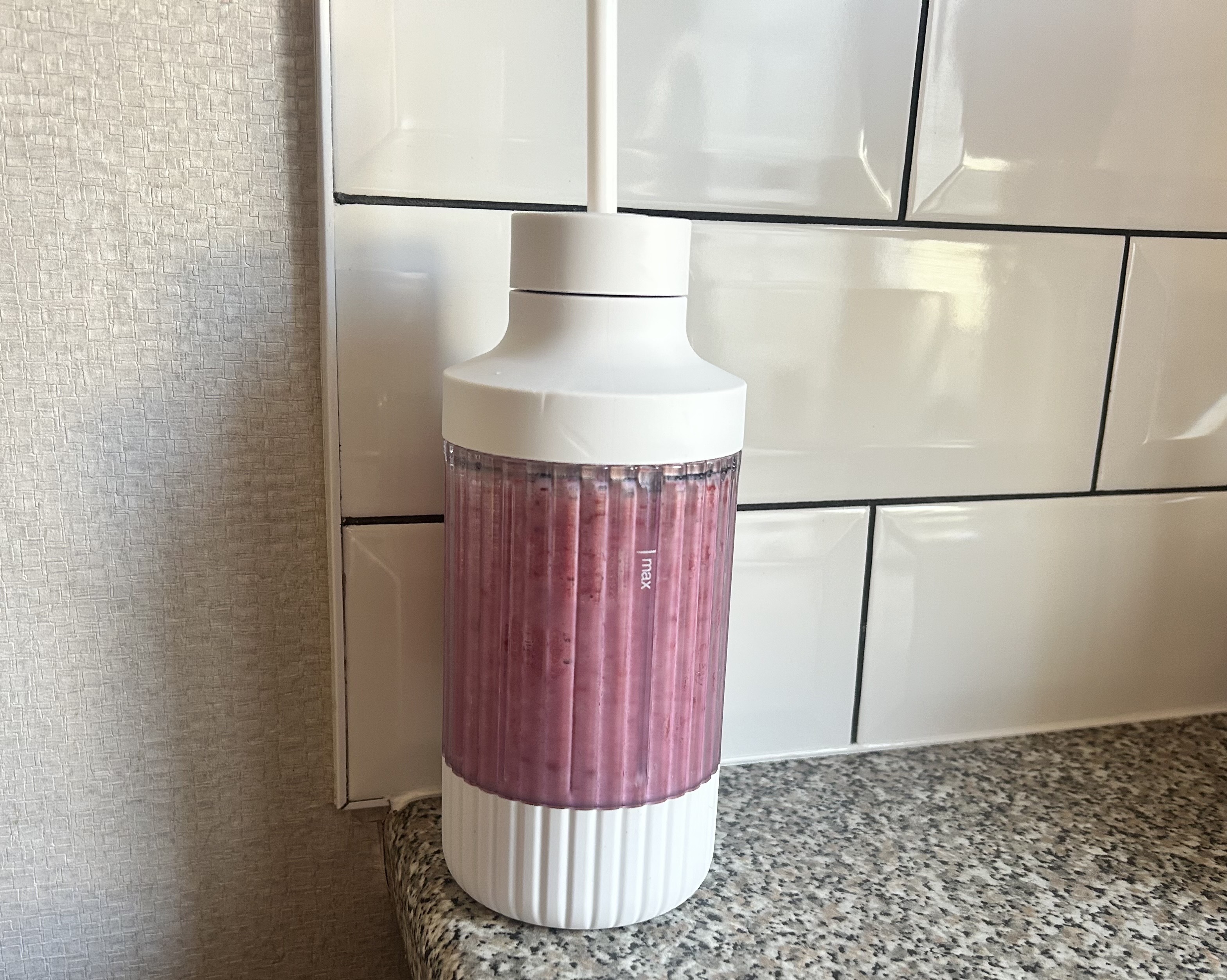 A berry smoothie made using the Beast Mighty 850 Plus in the included blend cup