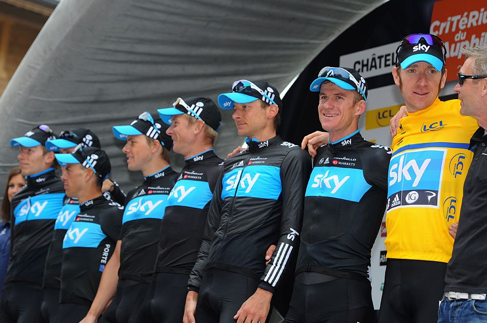 Team Sky stands with leader Bradley Wiggins at the Dauphin&eacute;