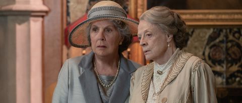 Penelope Wilton and Dame Maggie Smith looking concerned in Downton Abbey: A New Era.