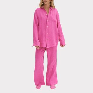 model wearing pink desmond & dempsey long sleeve linen pajama set