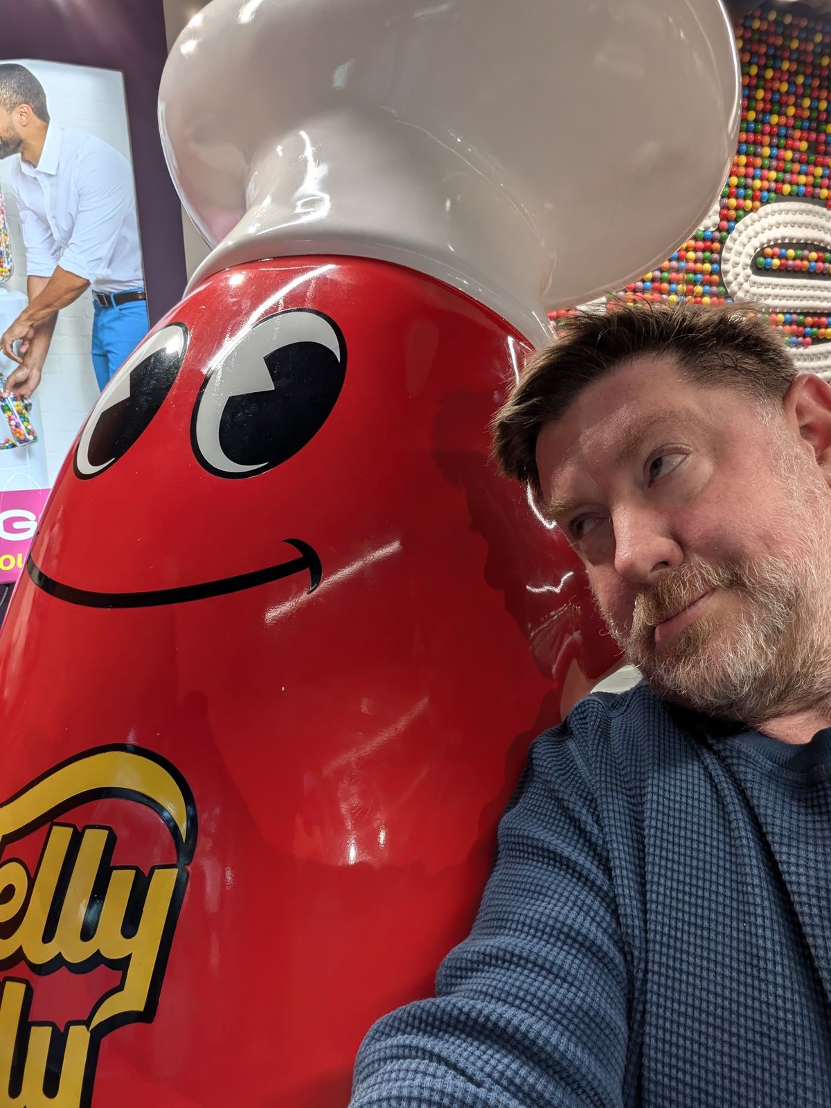 Selfie taken with a Jelly Belly mascot by a Pixel 8a