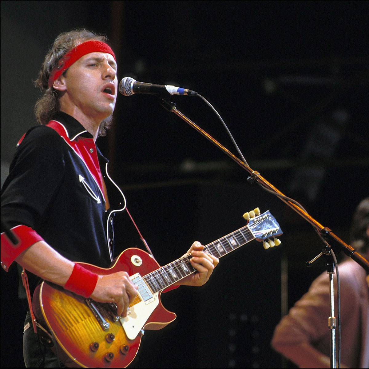 Mark Knopfler playing his Gibson Les Paul onstage at Live Aid in London on July 13, 1985