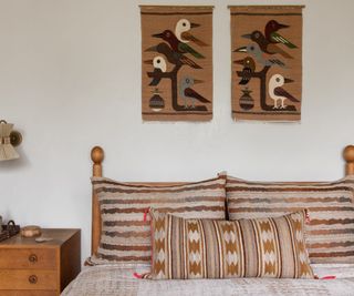 Boho bedroom with wall hangings