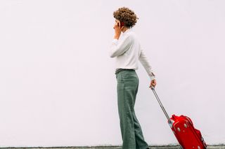 Woman at airport with suitcase