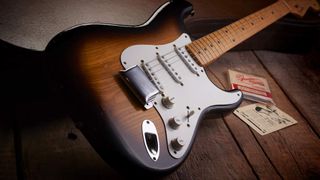 Vintage sunburst Fender Stratocaster on wooden floor