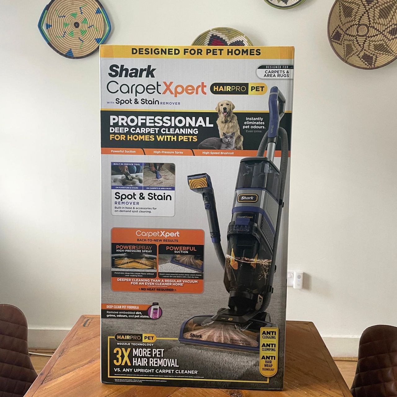 Shark CarpetXpert HairPro Pet Deep Carpet Cleaner with Spot Cleaner EX250UK box sitting on a wooden table in front of a white wall