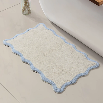 Dusk scalloped blue bath mat