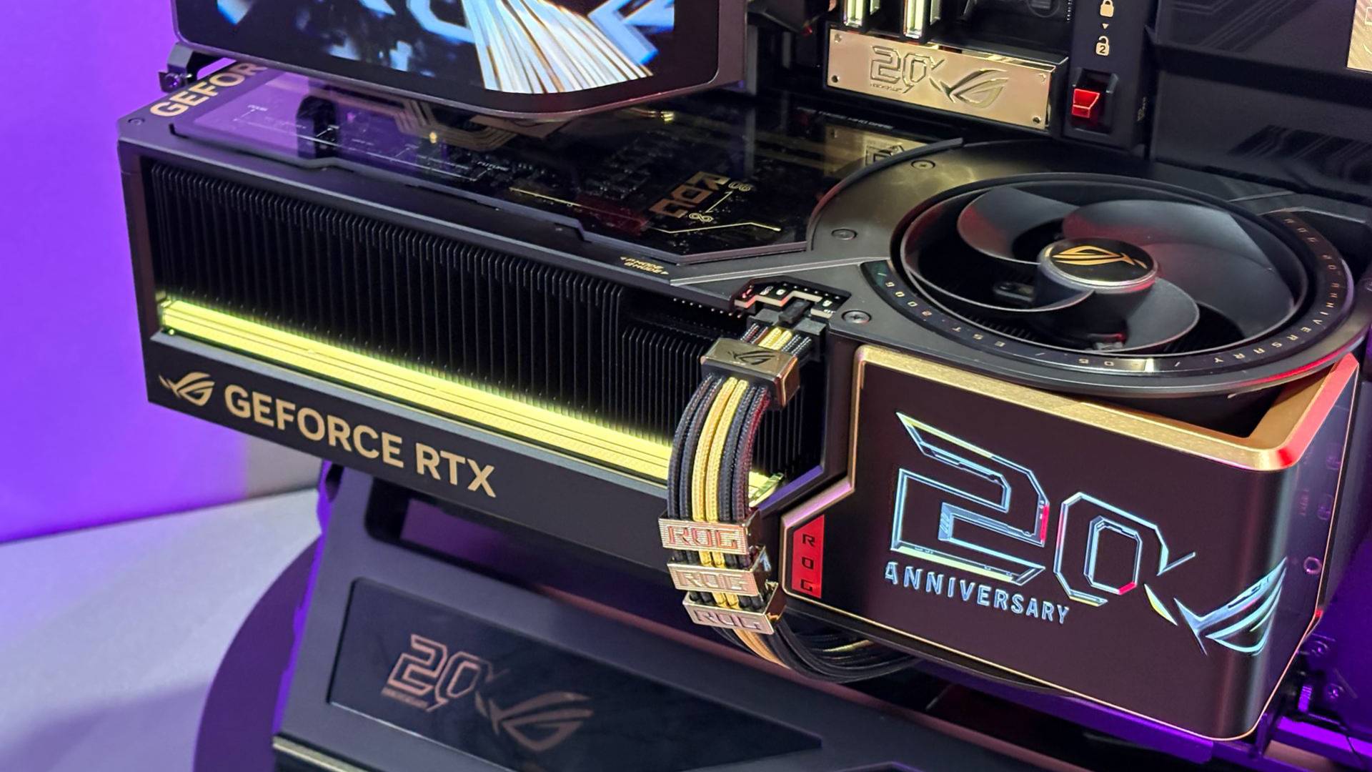 The ROG Astral GeForce RTX 5090 Edition 20 is seen mounted on the open-frame ROG GR20 PC case on the showfloor of Computex 2026.