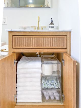 storage boxes in a bathroom cabinet