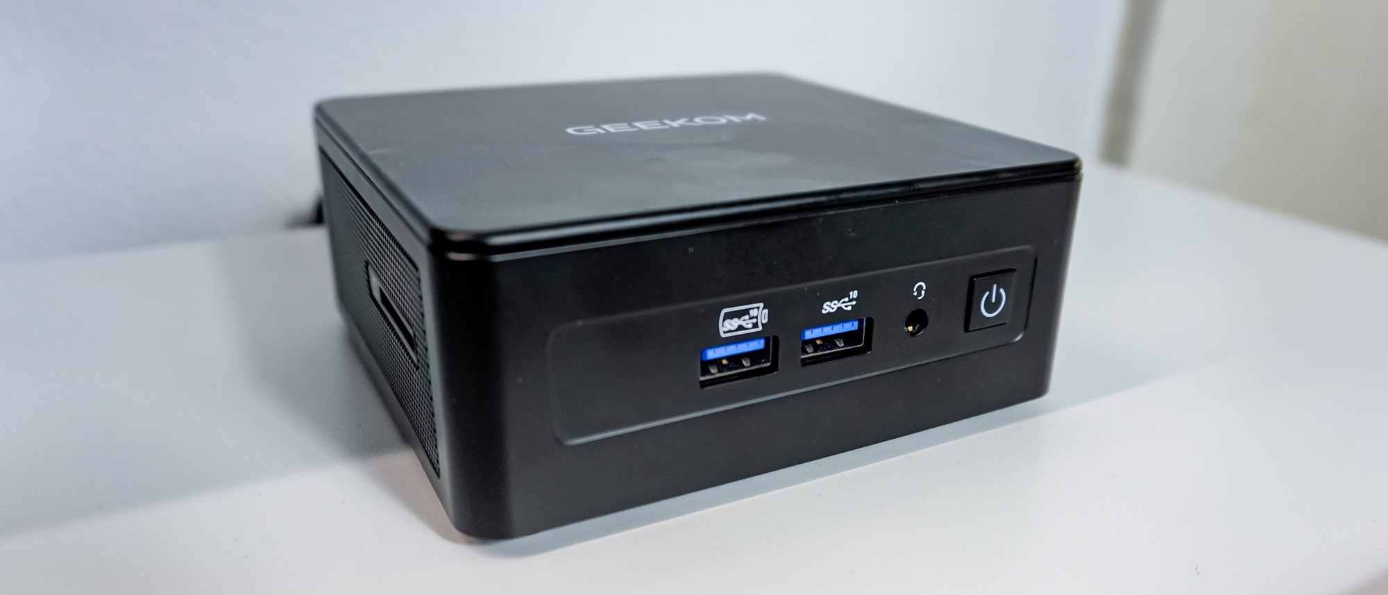 The Geekom IT15 mini PC on a desk