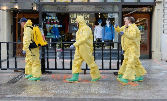 Boston Fire Department Hazardous Materials team clean the first blast site near the Boston Marathon finish line on April 22.