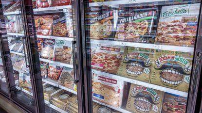 Frozen pizzas are seen in the aisle of a Publix grocery store in Surfside, Florida.