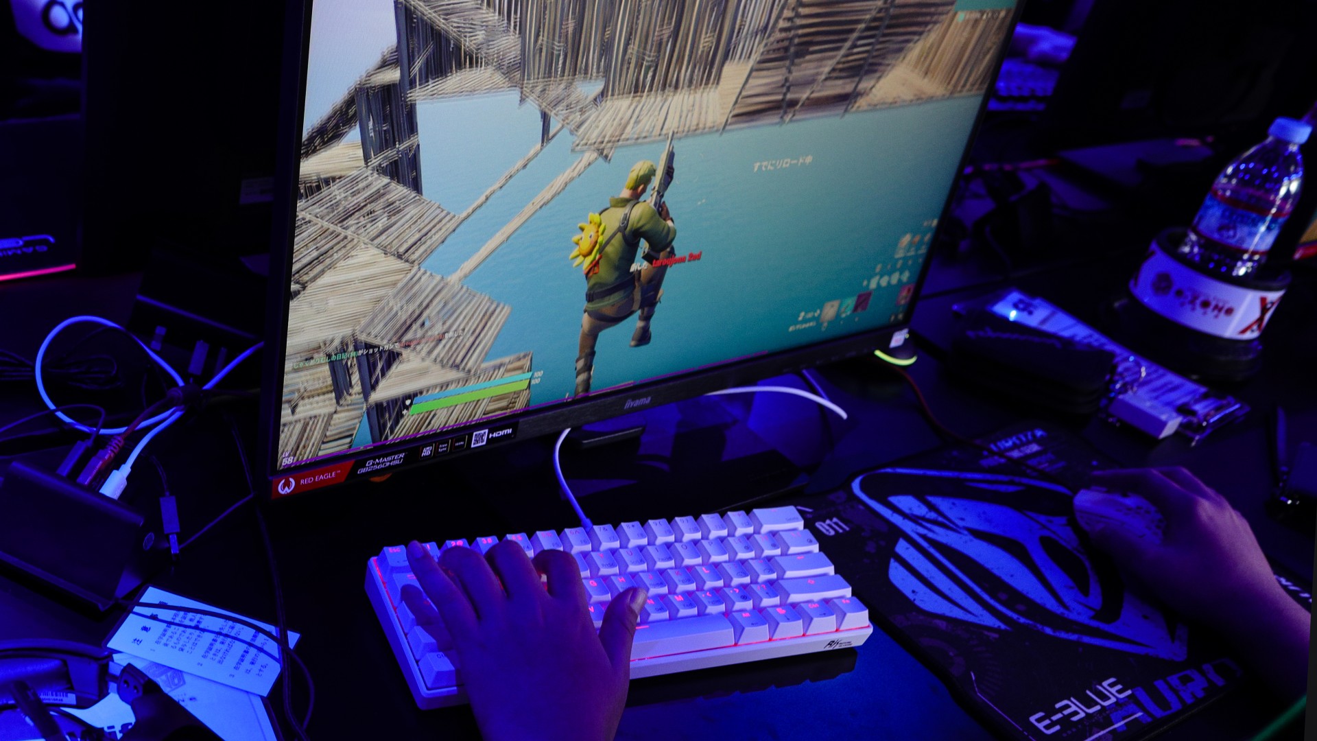 A gamer plays video games at an esports hotel E-Zone Denno Kukan