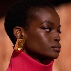 a beauty shot of a model walking in saint laurent fall winter 25 runway