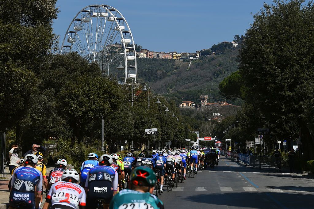MONTECATINI TERME ITALY MARCH 25 A general view of the peloton competing with a fair ferris wheel in the background during the 36th Settimana Internazionale Coppi e Bartali 2022 Stage 4 a 1587km stage from Montecatini to Montecatini CoppieBartali on March 25 2022 in Montecatini Terme Italy Photo by Dario BelingheriGetty Images