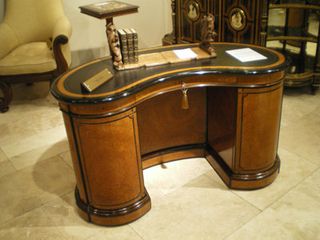 Curved library table by Gillows, with Butchoff