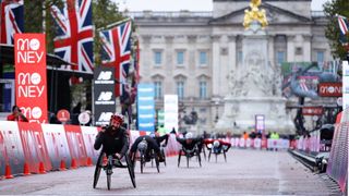 Brent Lakatos of Canada celebrates as he crosses the finish line in first place in the Wheelchair race during the 2020 Virgin Money London Marathon