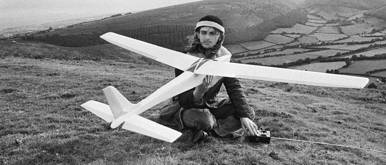 Mike Oldfield with a toy glider on Hergest Ridge, Herefordshire, in 1974