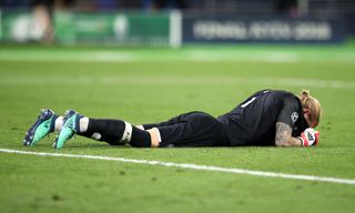 Loris Karius lies on the pitch after his errors led to Liverpool's defeat