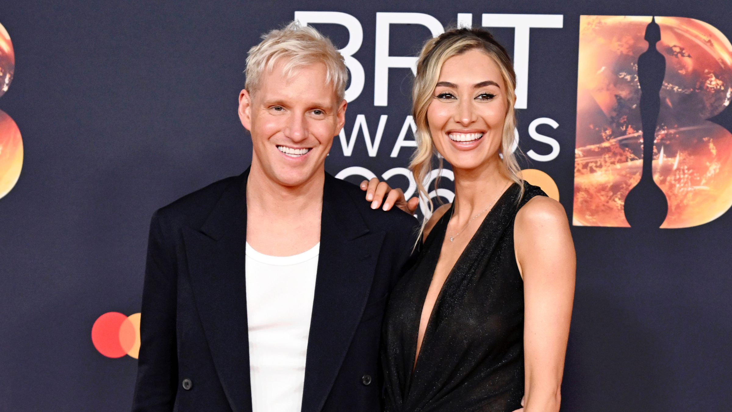 Sophie Habboo and Jamie Lang wearing black at the Brit awards 2026