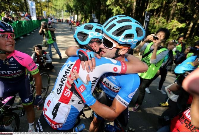 Haas and a teammate celebrate his victory at the Japan Cup