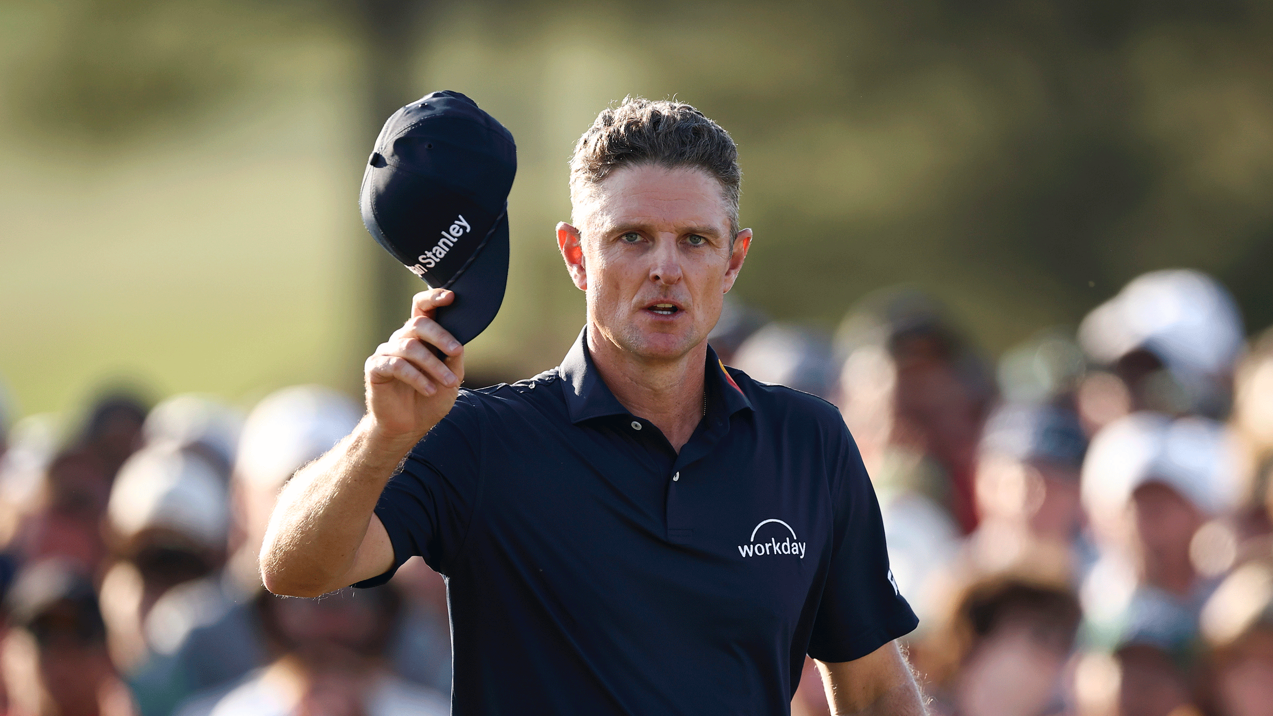 Justin Rose raises his cap to the patrons at Augusta National during the final round of The Masters in 2026