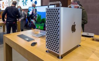 Paris, France - Nov 26, 2021: People inside Apple Computers Store with new Mac Pro workstation with Apple XDR display
