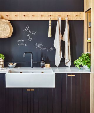 blackboard painted splashback area above kitchen sink