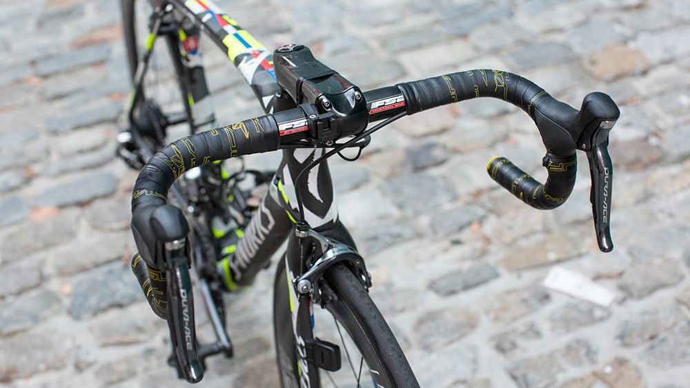 Shimano Dura-Ace Di2 sprint shifters are tucked just under and inboard of the hoods