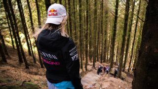 Tahnee Seagrave looking at the rock drop at RedBull Hardline in the Dyfi Valley, Wales on July 10th, 2023.