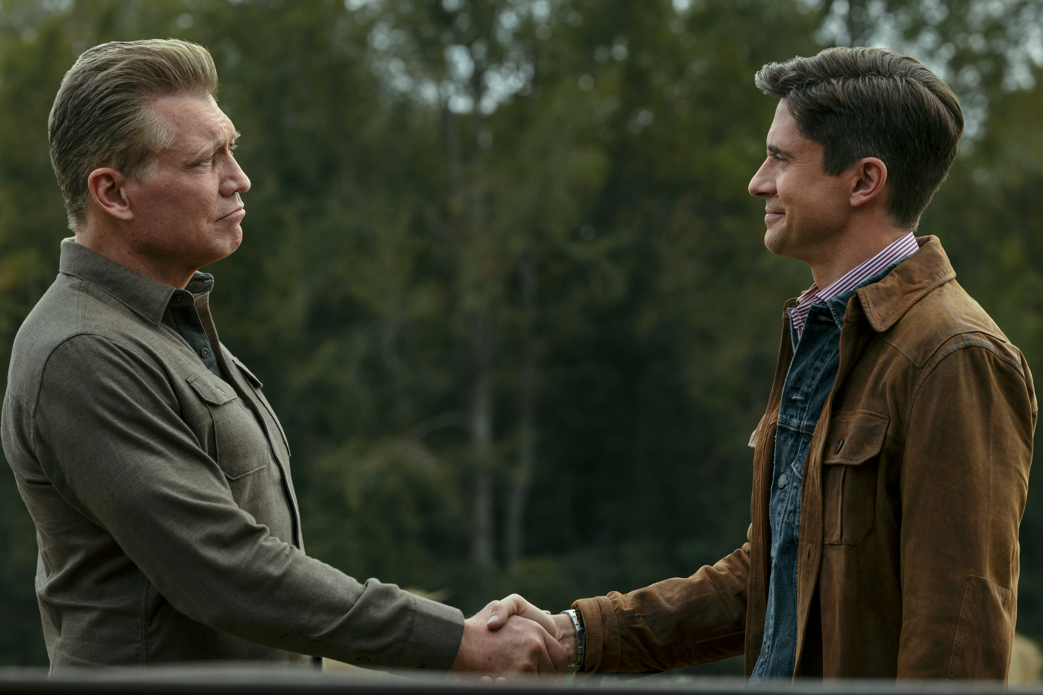 holt mccallany as Harlan Buckley shaking hands with topher grace as grady in the waterfront