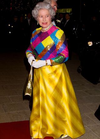 The Queen wearing a mutli-coloured outfit