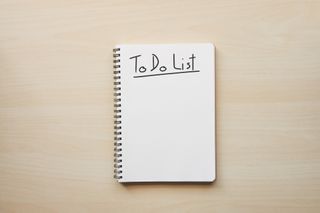 image of a spiral notebook with the words to do list written on a page