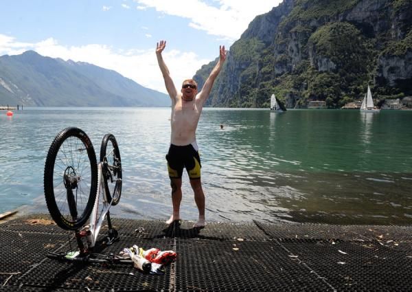 A racer celebrates a successful 2012 TransAlp