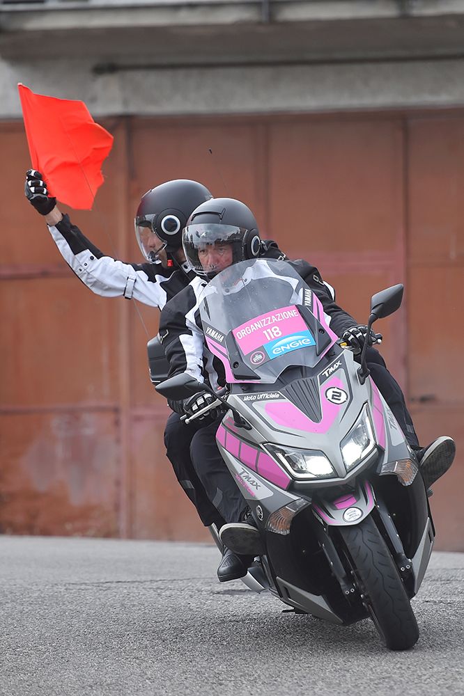 The red flag comes out to sign the neutralisation of the race after a photo moto crash