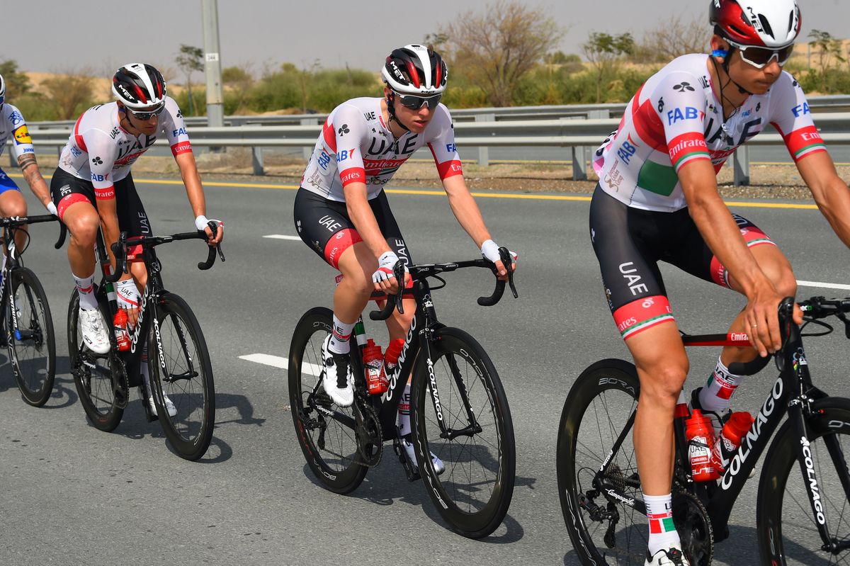 Tadej Pogacar rides with his UAE teammates
