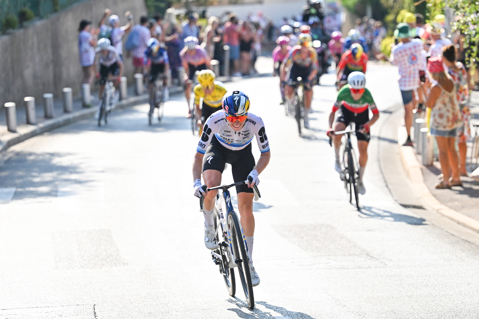 Stage winner Demi Vollering attacks on stage 8 of the Tour de France Femmes