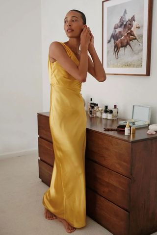 TyLynn Nguyen wears a yellow dress