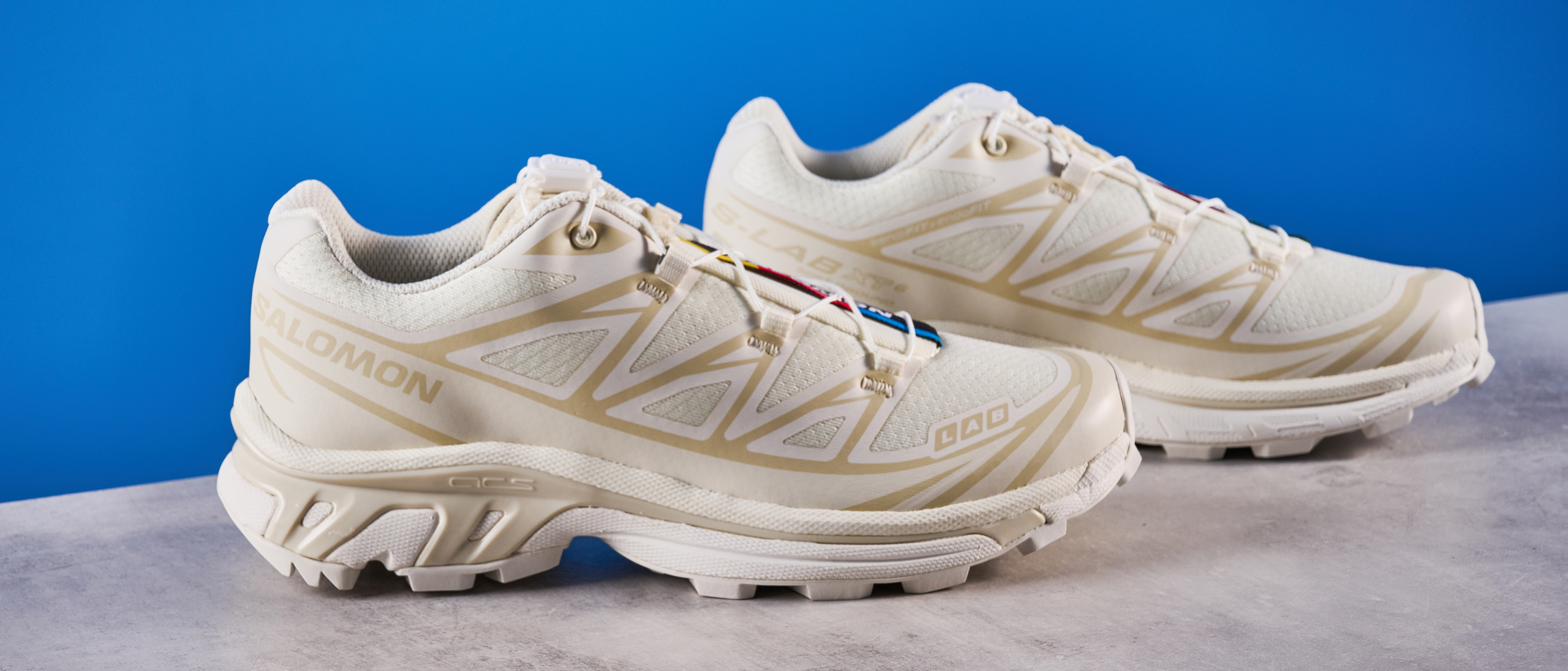 Salomon XT-6 in Vanilla Ice photographed in front of a blue background