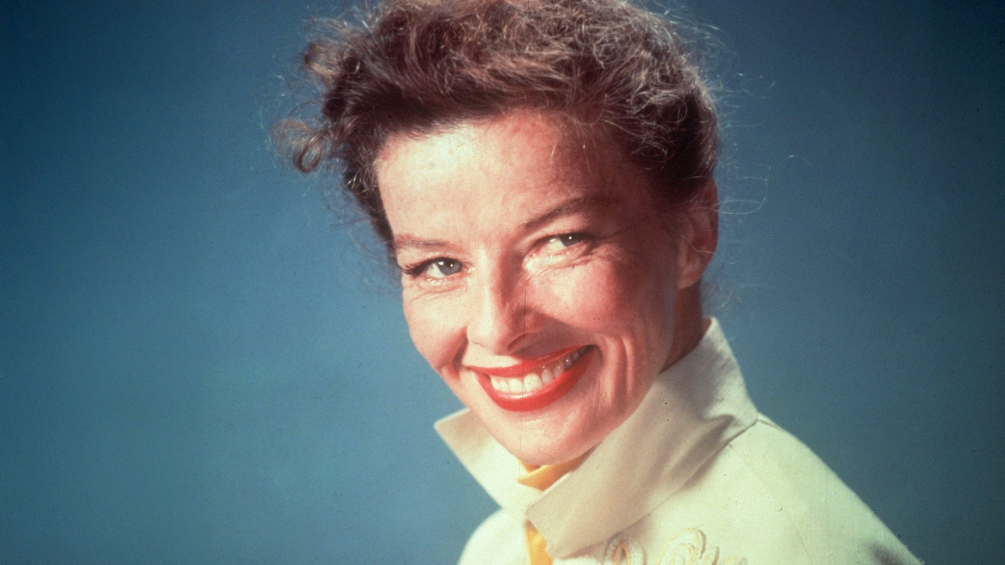 katharine hepburn on a blue background
